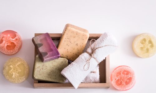 Beauty care products in wooden box. soap, towel.Spa or personal hygiene consept